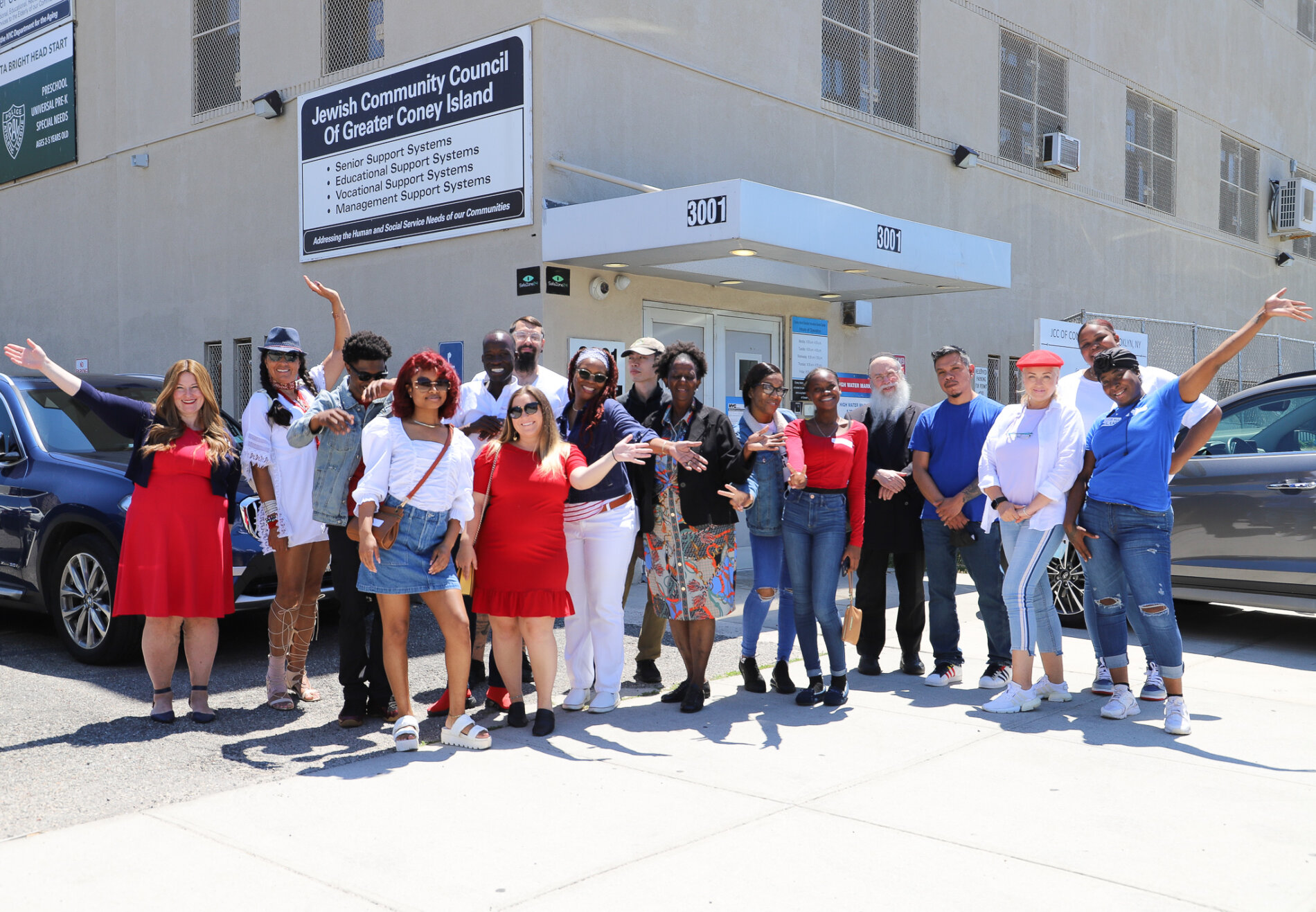 group photo in front of JCGCI building
