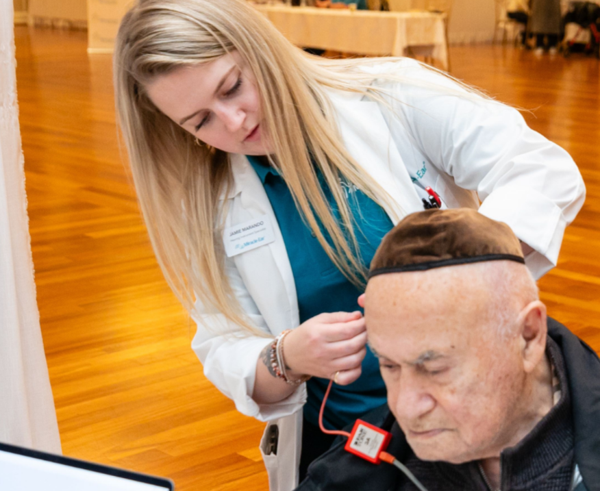 A doctor observing a survivor