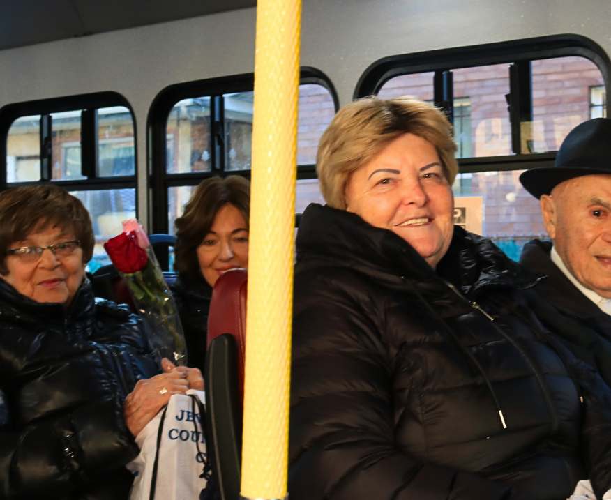 Four survivors riding a bus