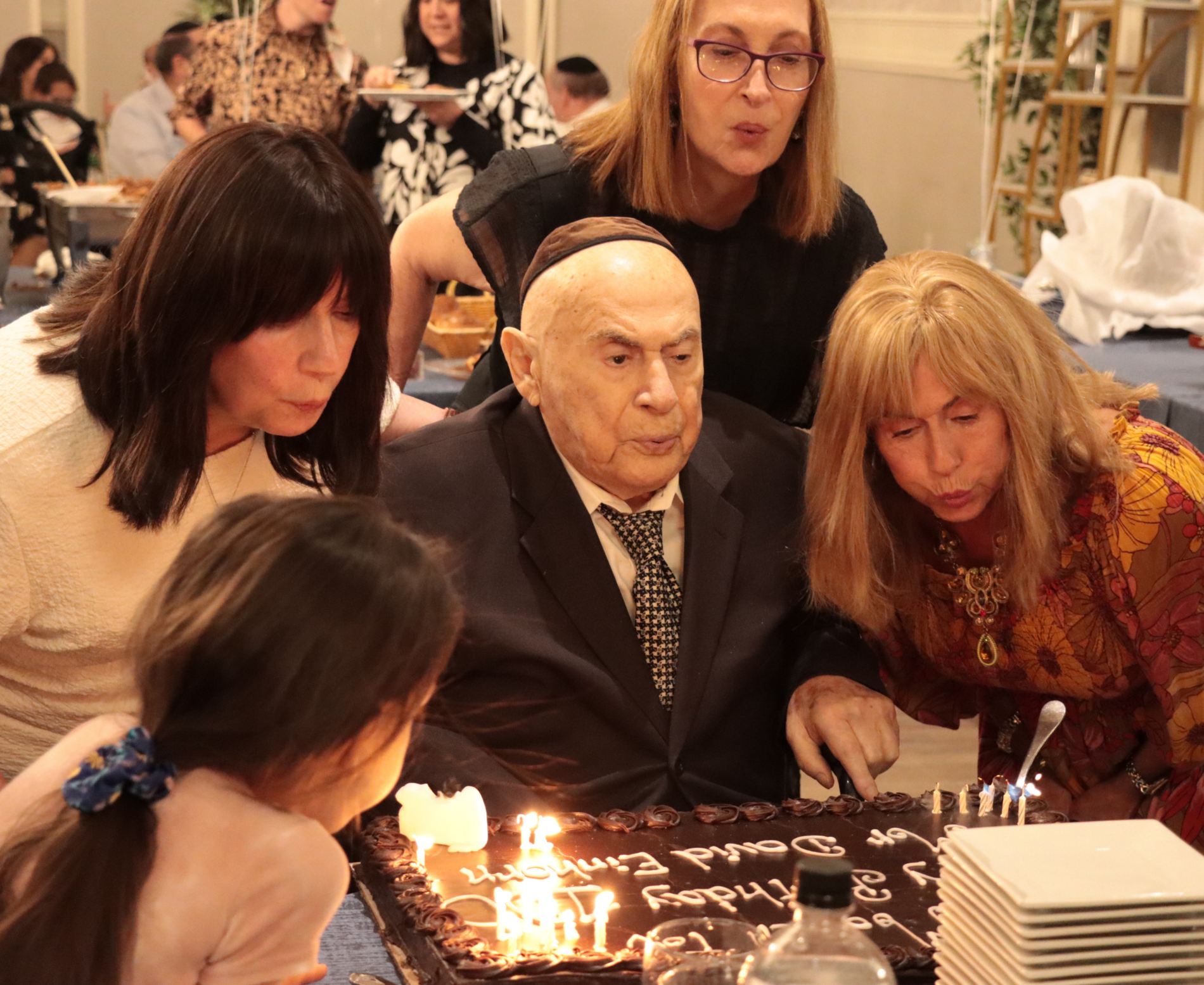 David Einhorn blowing out his birthday candles with his family