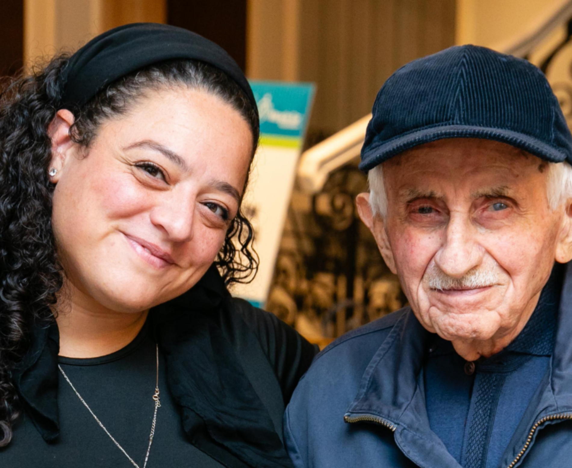 An older survivor smiling with a younger woman