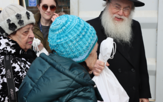 Exec Director Rabbi Wiener handing out food