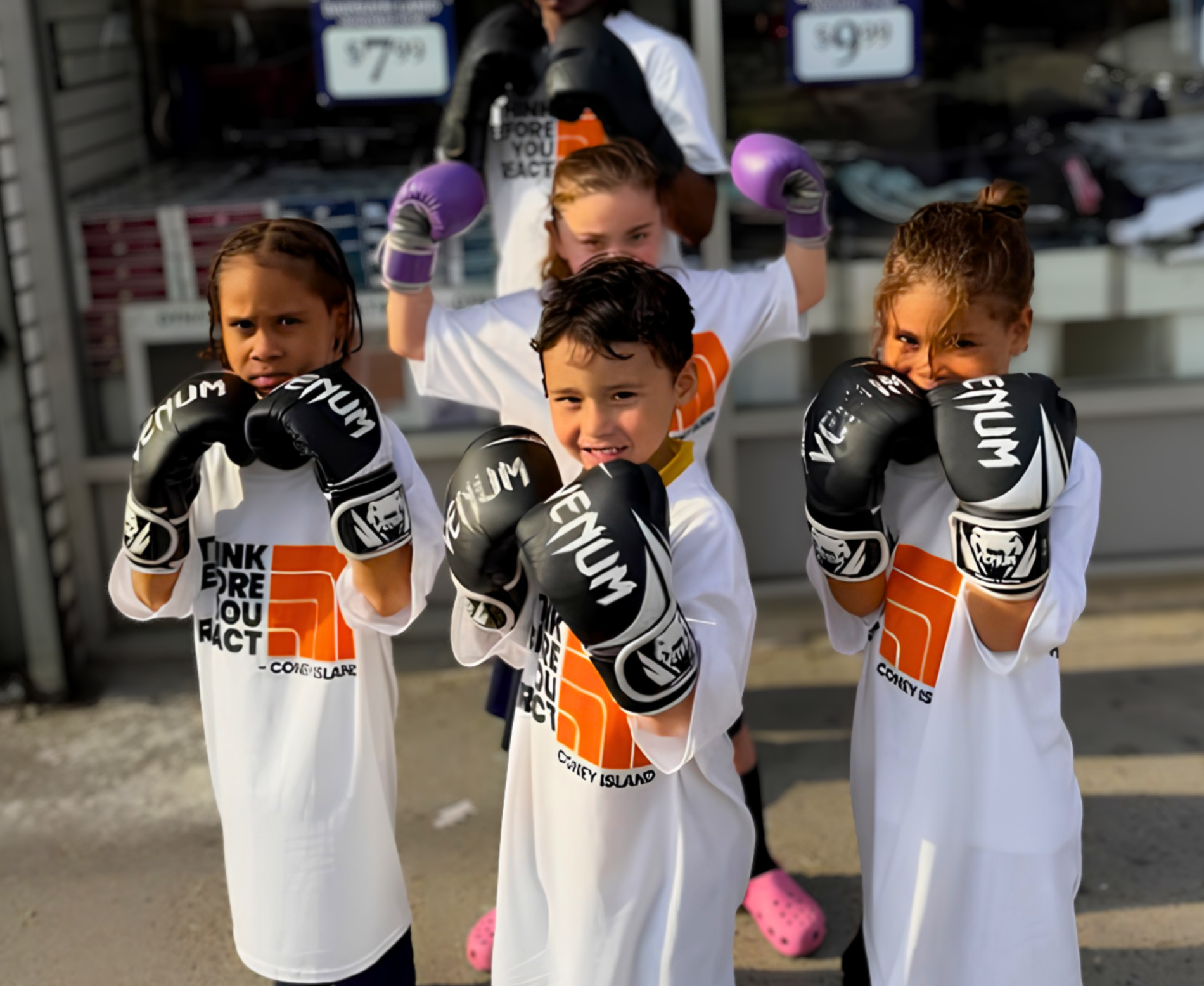 kids showing off their boxing gloves
