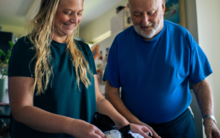 A woman helping a man with organizing food