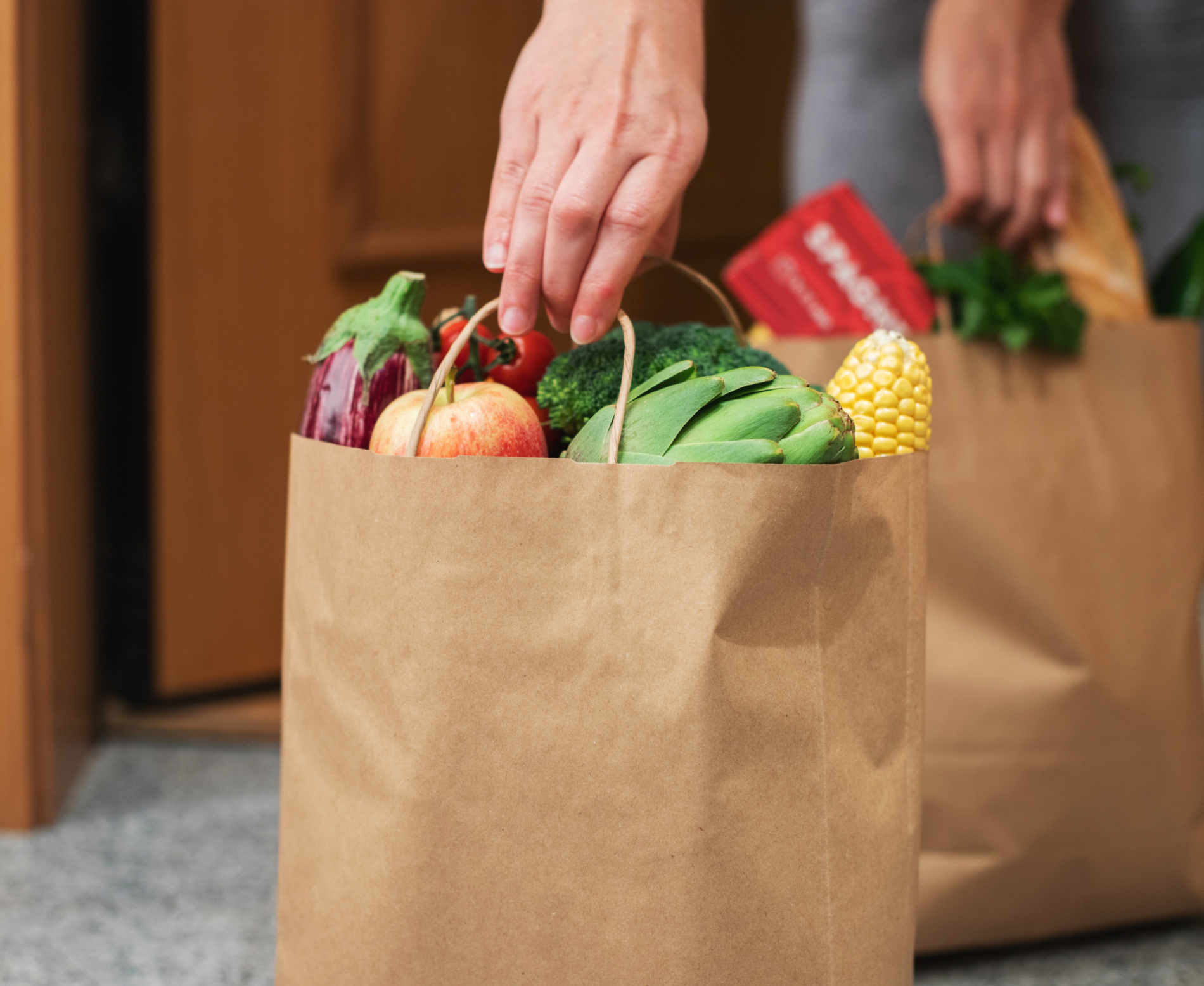 Someone lifting groceries