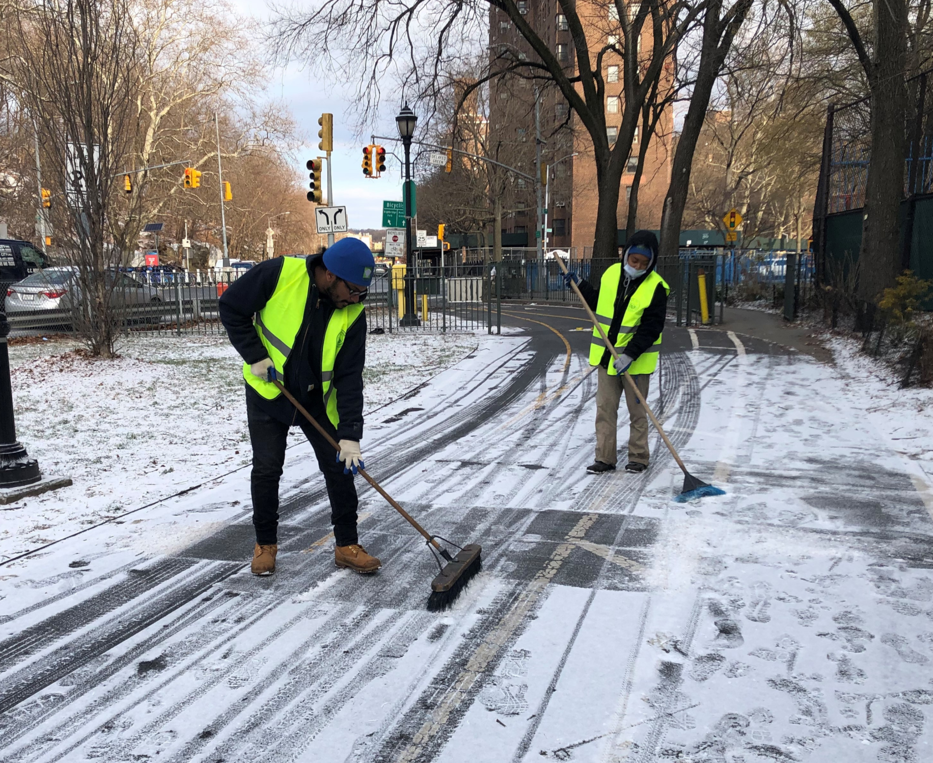 Community members clearing snow from the ground