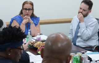 Operation HOOD Director Terence Rice speaking with the Deputy Mayor