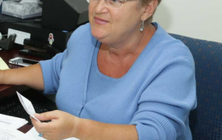 Veronica Beres, HICC Director, talking to a client