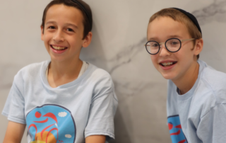2 kids smiling together