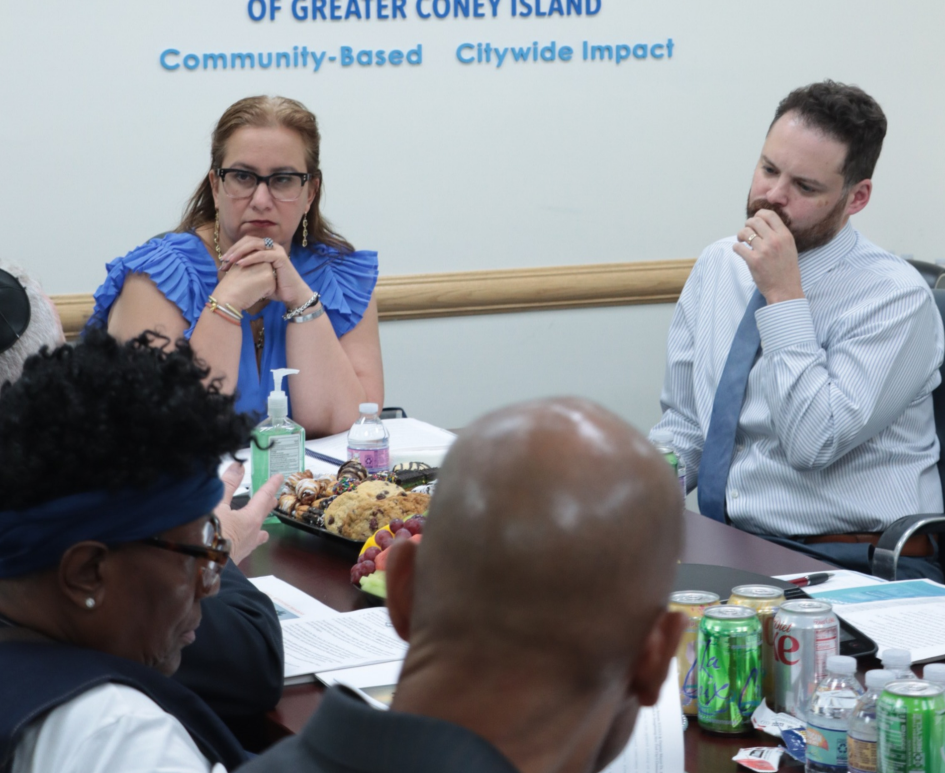 website imagery + headhshots Operation HOOD Director Terence Rice speaking with the Deputy Mayor