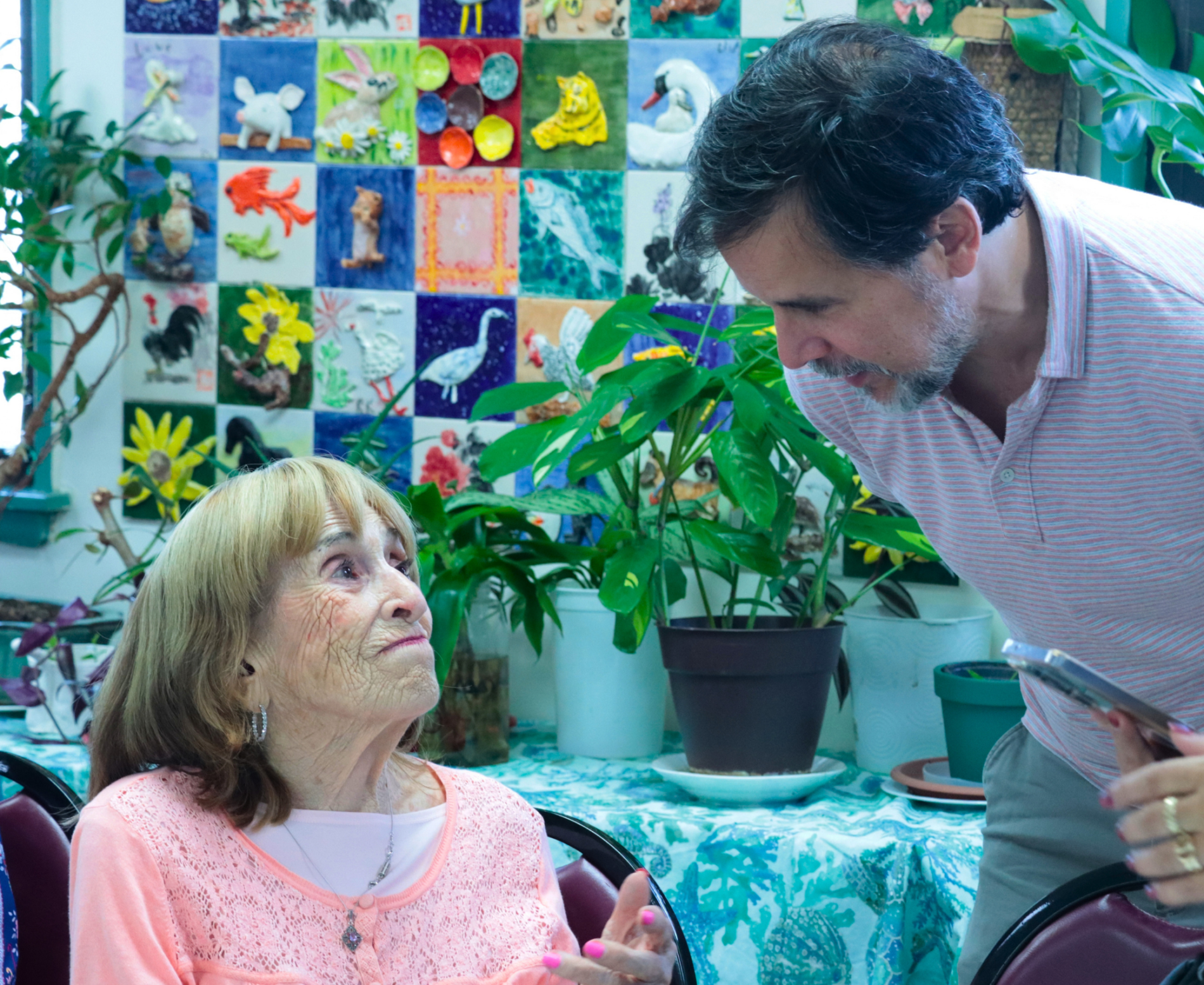 A Holocaust survivor speaking to a community leader