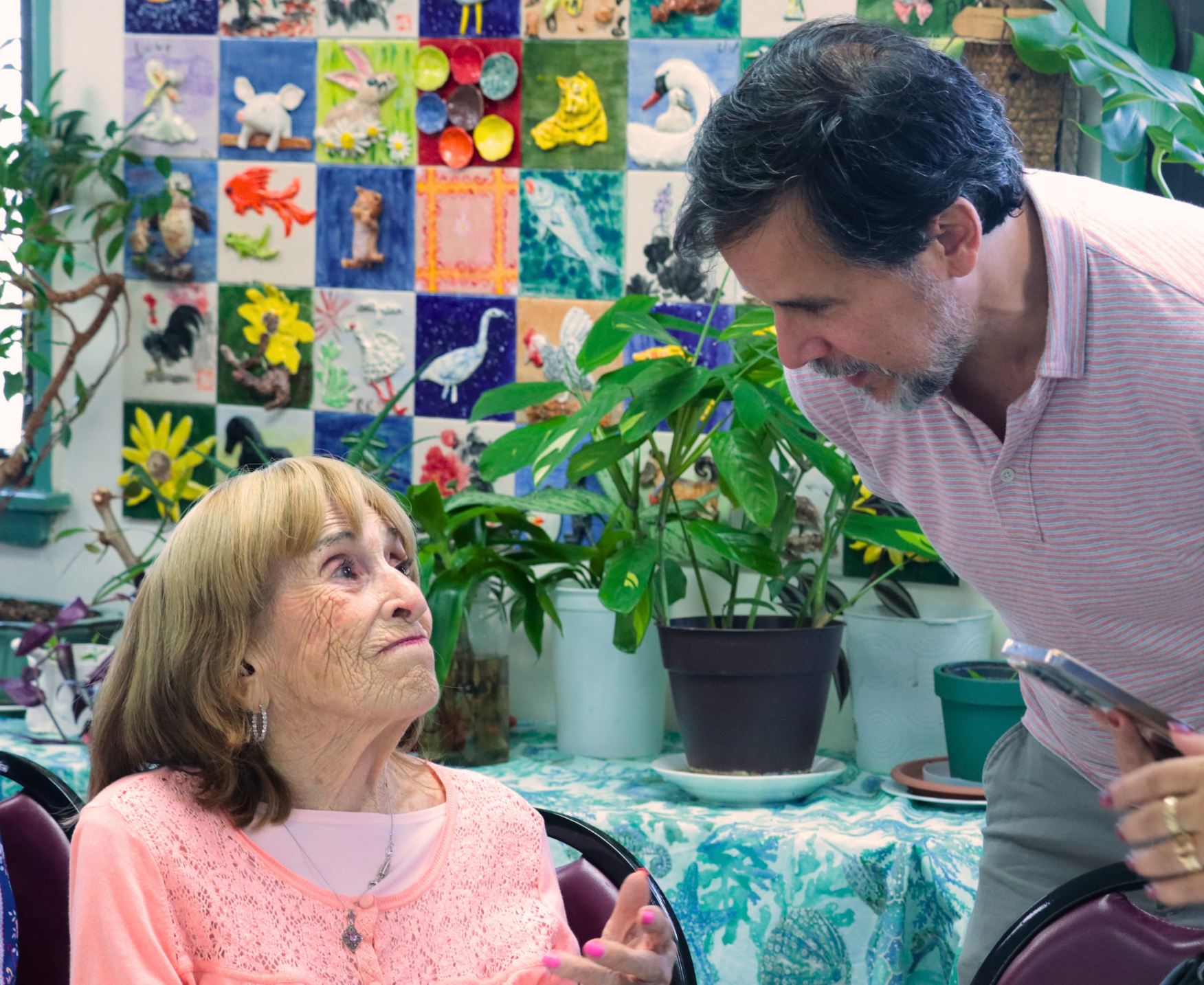 A Holocaust survivor speaking to a community leader