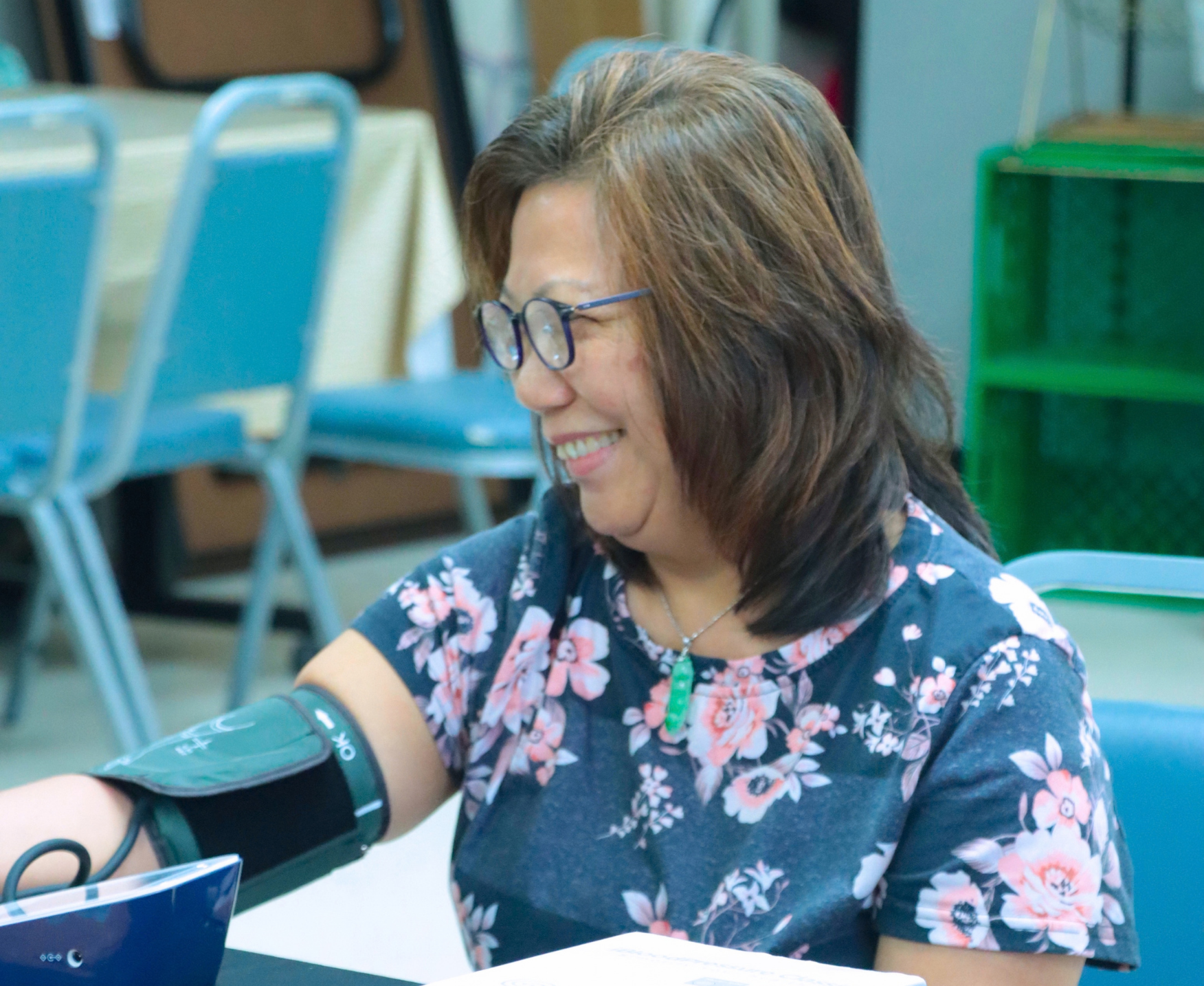 Older adult getting a blood pressure screening