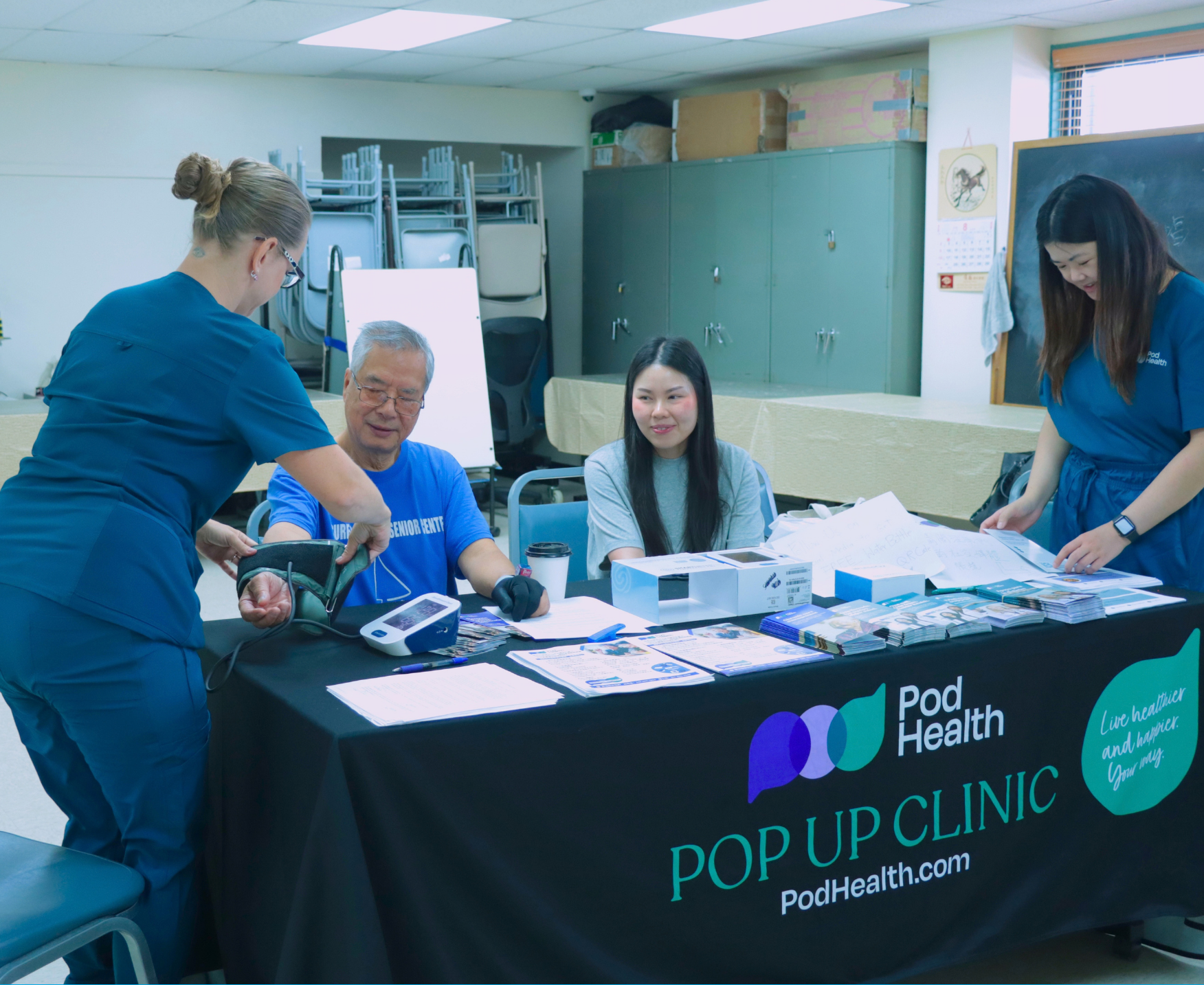 Pod Health reps giving a blood pressure screening