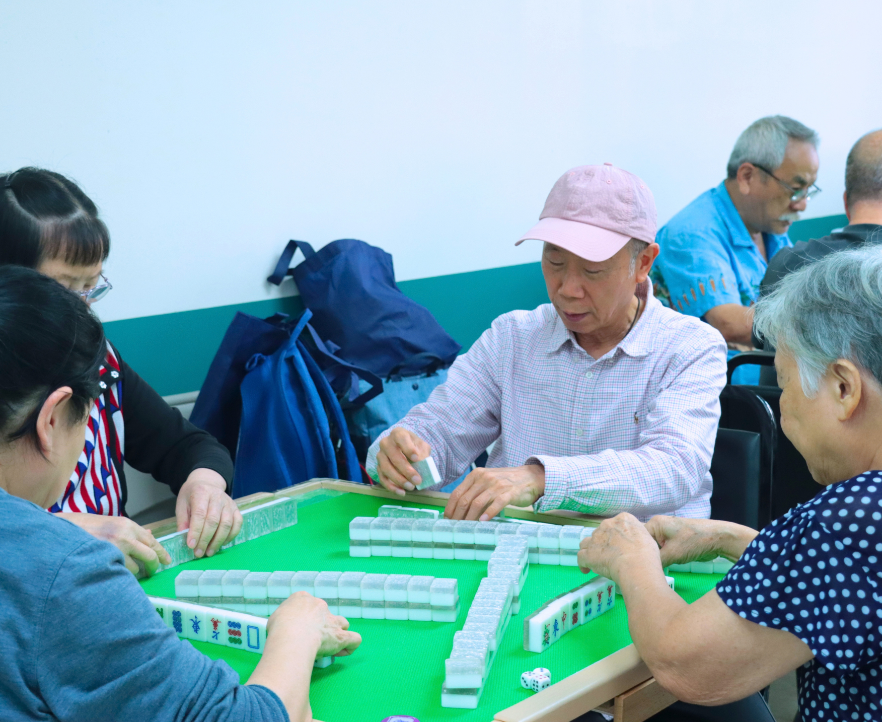 Older adults playing mahjong