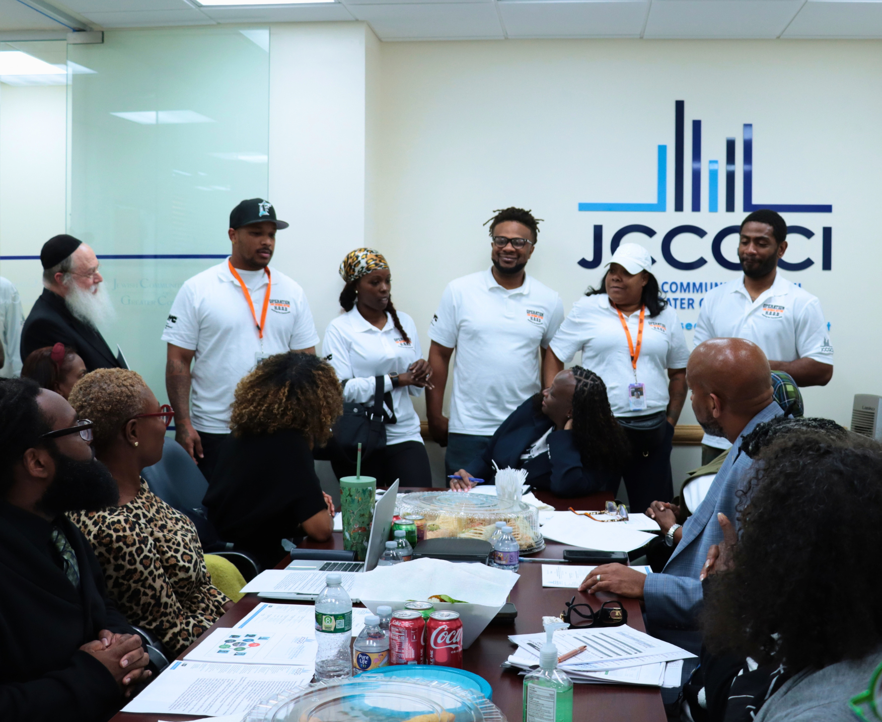 Operation H.O.O.D. team speaking to Deputy Mayor Francois