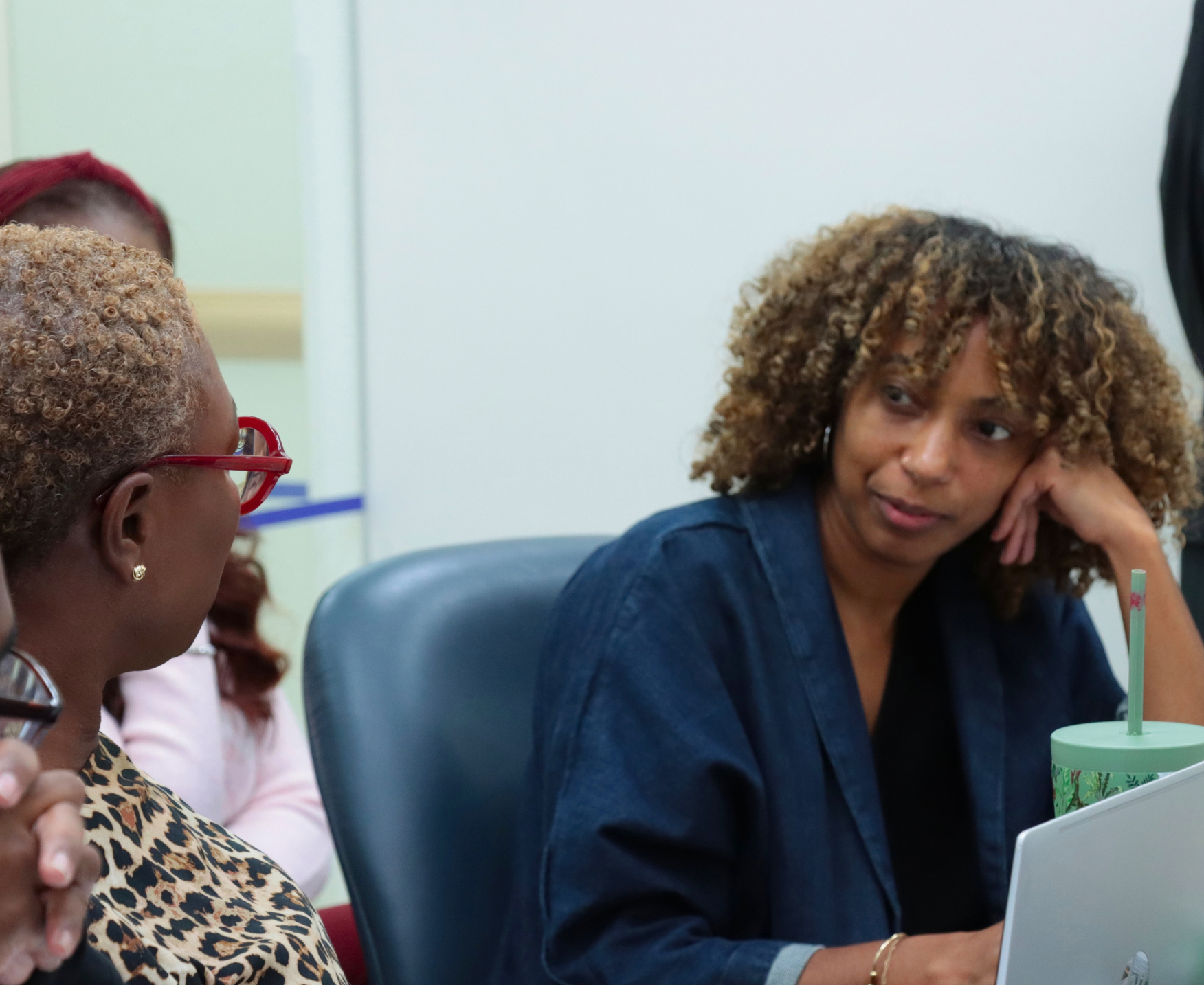 A program director speaking to Commissioner of the Mayor’s Office of Community Safety Dr. Ayesha Delany-Brumsey